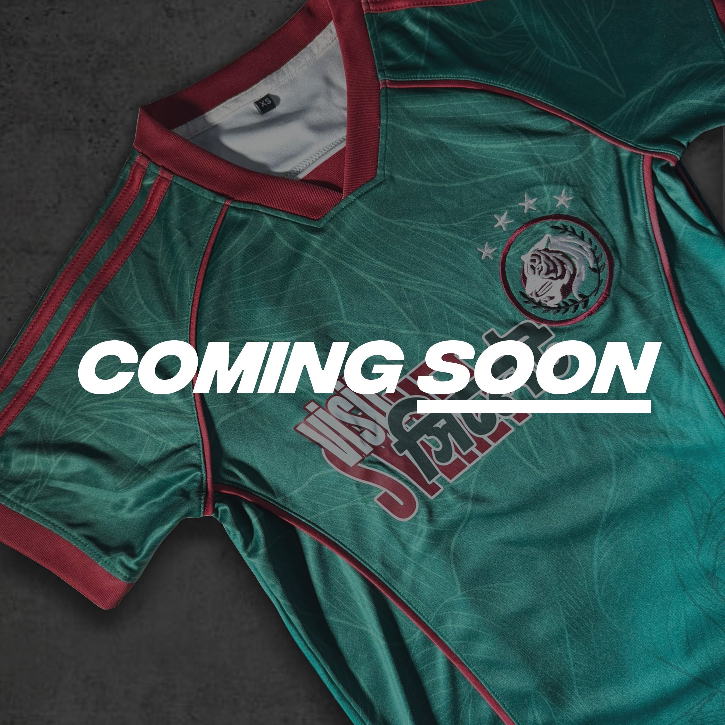 Beetle Green Bangladesh jersey with Crimson red accents on a dark surface, featuring 'Coming Soon' text.